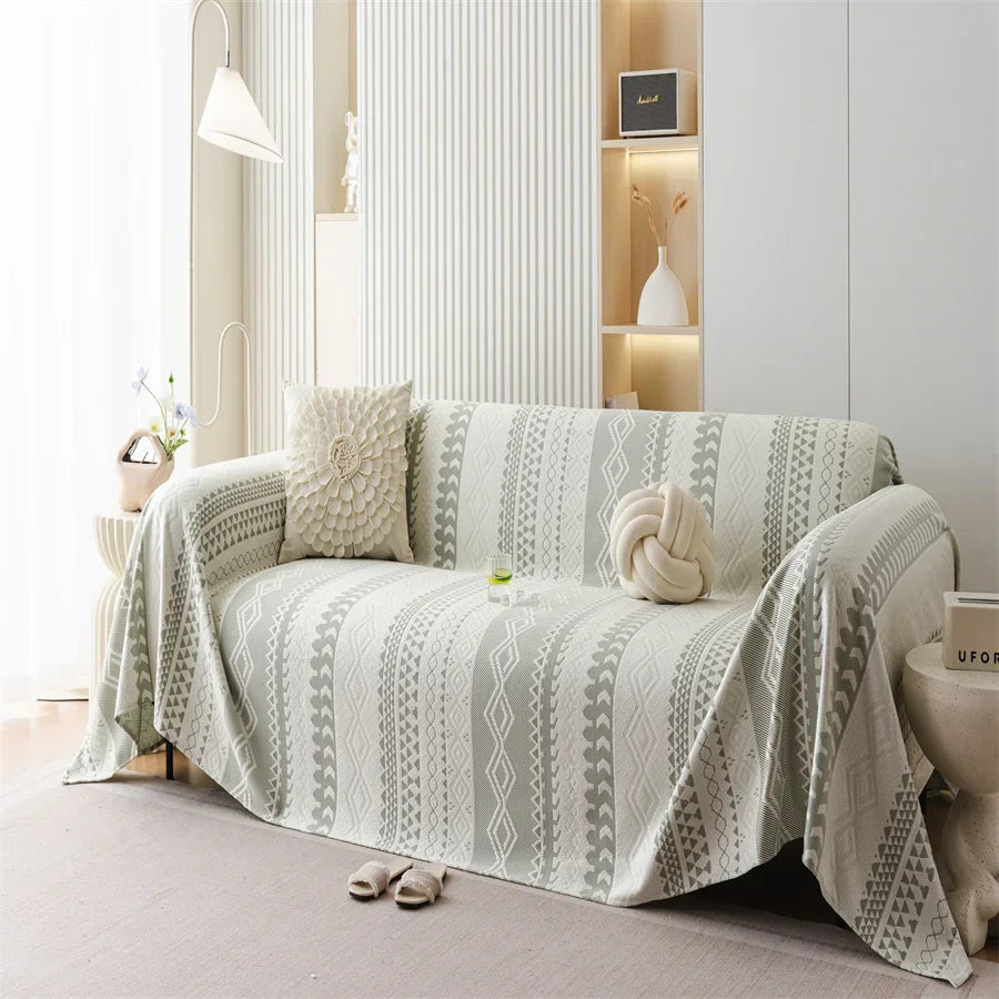couverture canapé moderne motif géométrique gris beige deux coussins décoratifs
