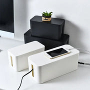 boîte rangement câbles moderne blanc noir organisation salon minimaliste