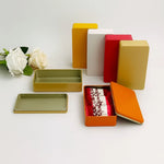 boîte rangement métal réutilisable contenant thé bijoux organisation moderne orange intérieur beige