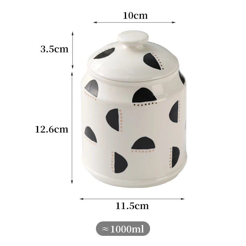 Pot de rangement en céramique blanche avec motifs noirs ronds et pointillés, d'une capacité approximative de 1000 ml.