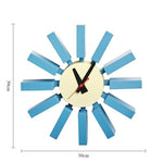 Horloge murale mid century bleu orange noir aiguilles rouge cadran blanc atomique époque
