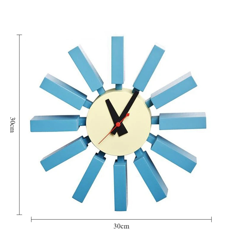 Horloge murale mid century bleu orange noir aiguilles rouge cadran blanc atomique époque
