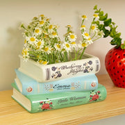 vase céramique livres vintage fleurs séchées succulentes étagère salon blanc vert bleu