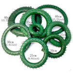 décoration noël couronne verte moderne branches baies rouges cônes pin taille 15 20 25