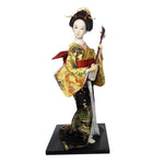 poupée japonaise geisha argile broderie florale motifs géométriques accessoires traditionnels blanc rouge vert bleu