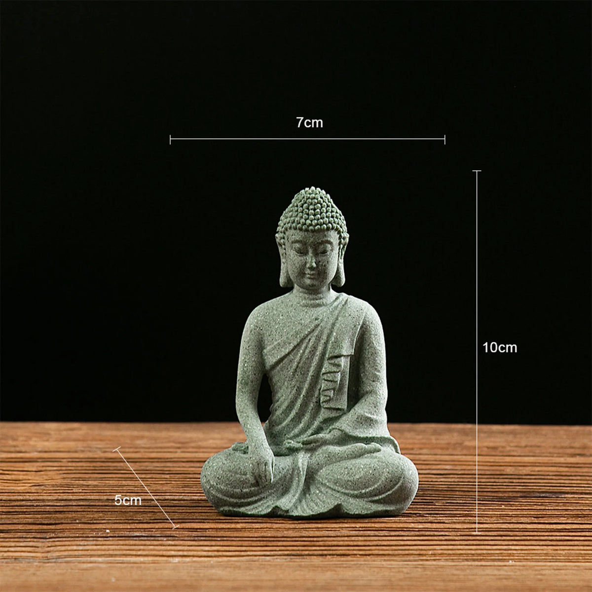 statuette bouddha assise gris vert texture pierre zen minimaliste abstraite galets mousse plateau noirscriçãopta