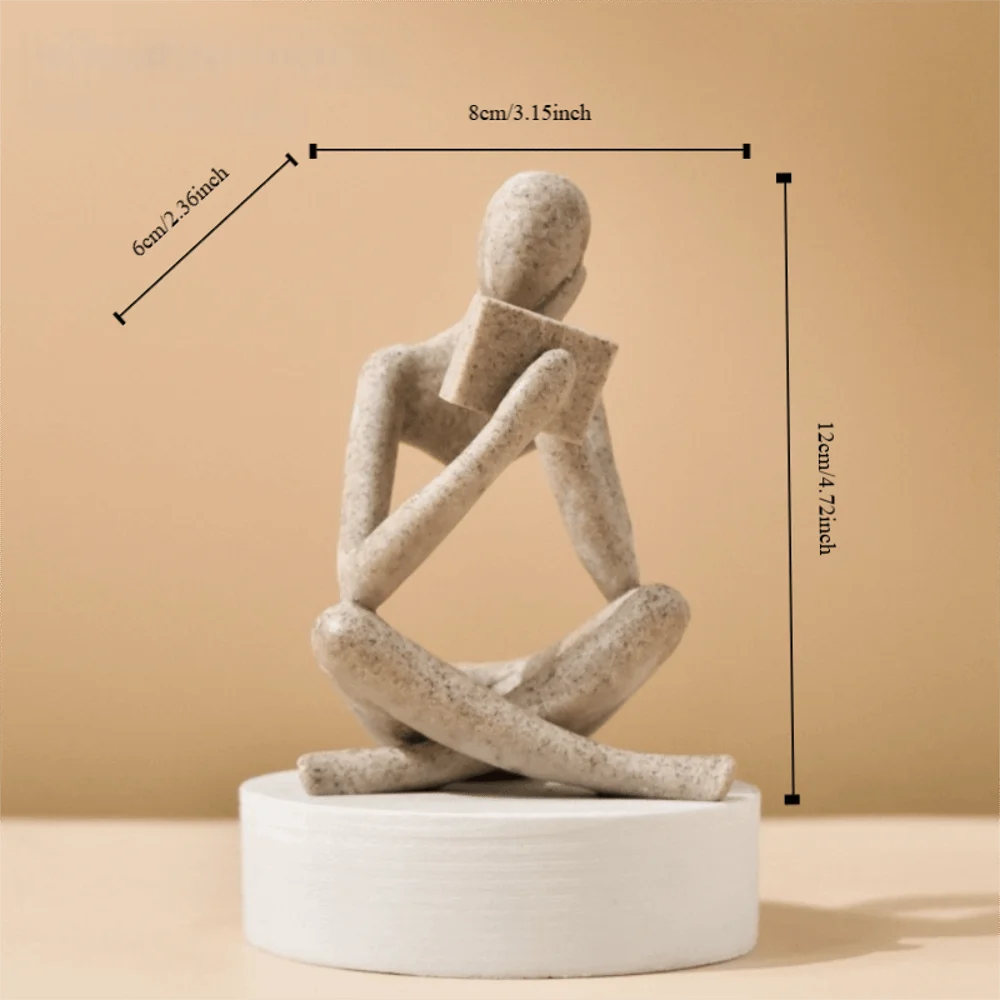 figurine deco moderne or noir blanc personne assise livre socle chambre abstraction minimalisme