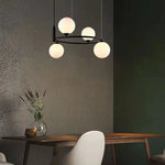 suspension luminaire moderne sphères verre translucides anneau métal doré salon chambre scandinave