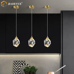 suspension lumineuse moderne transparente facettes géométriques dorées élégante autoinstallation led chambre salon