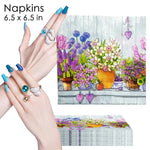 serviettes papier serviettes florales motif fleurs pots arrière plan bois rose violet bleu jaune