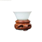 support bois sculpté vintage marron clair découpes décoratives artisanat traditionnel stand thé pot