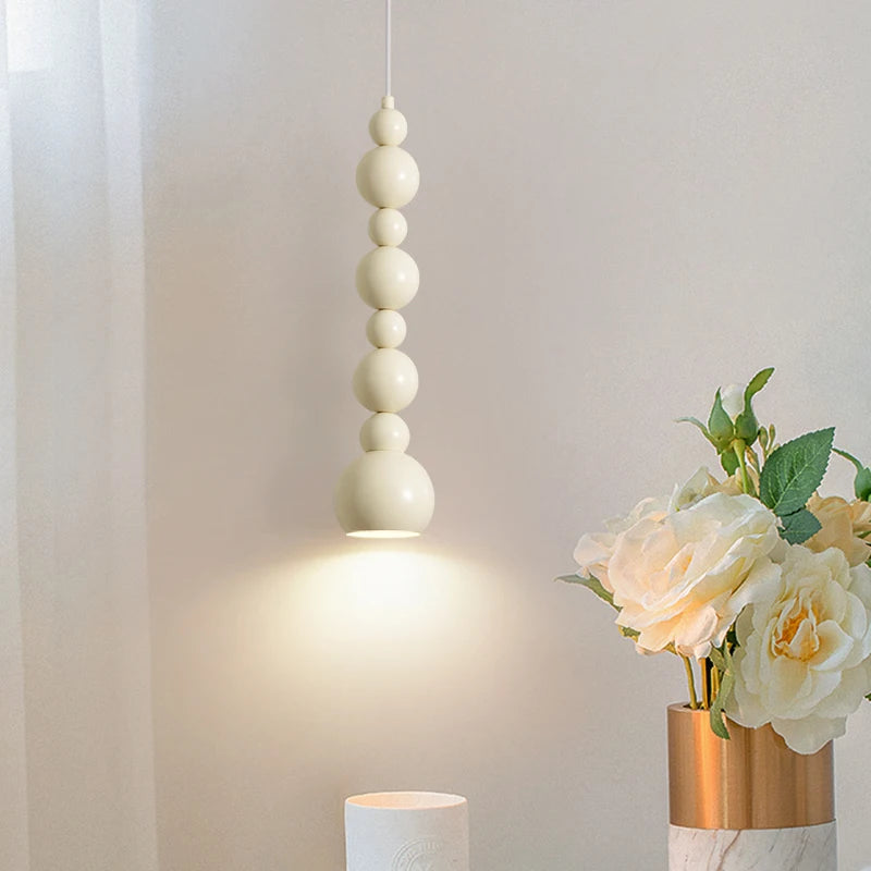 suspension lumineuse moderne minimaliste blanc beige rose sphères imbriquées scandinave suspension câble