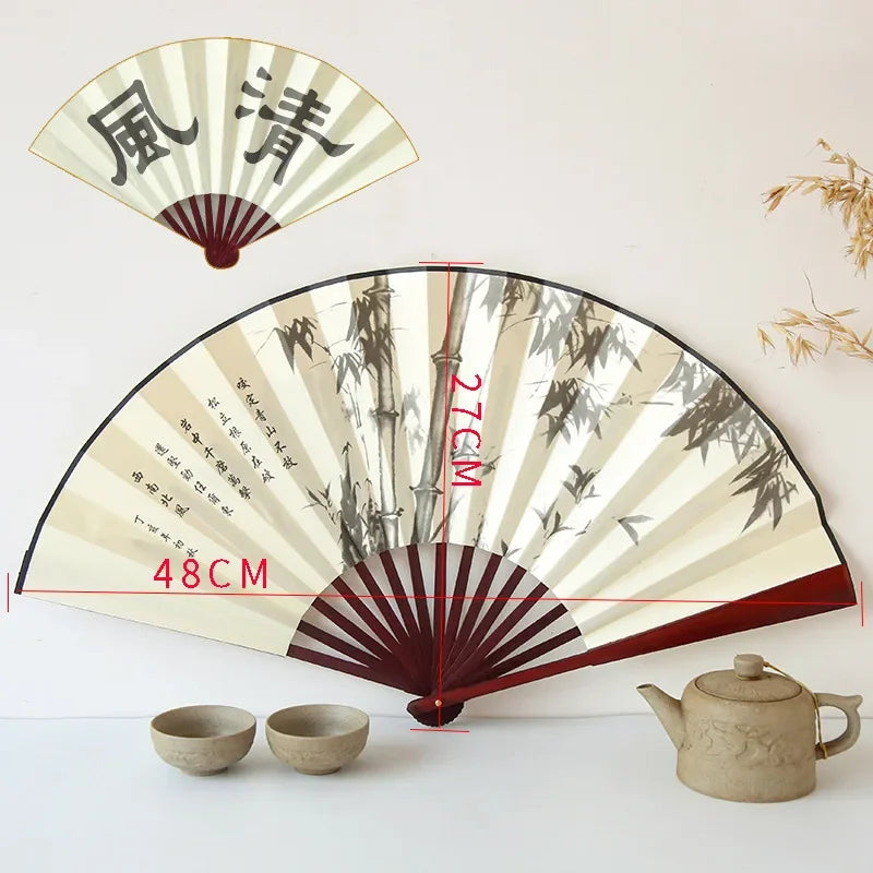 éventail traditionnel artisanal peinture paysage calligraphie nervures bambou tissu beige brun fixations métal 27x48cm