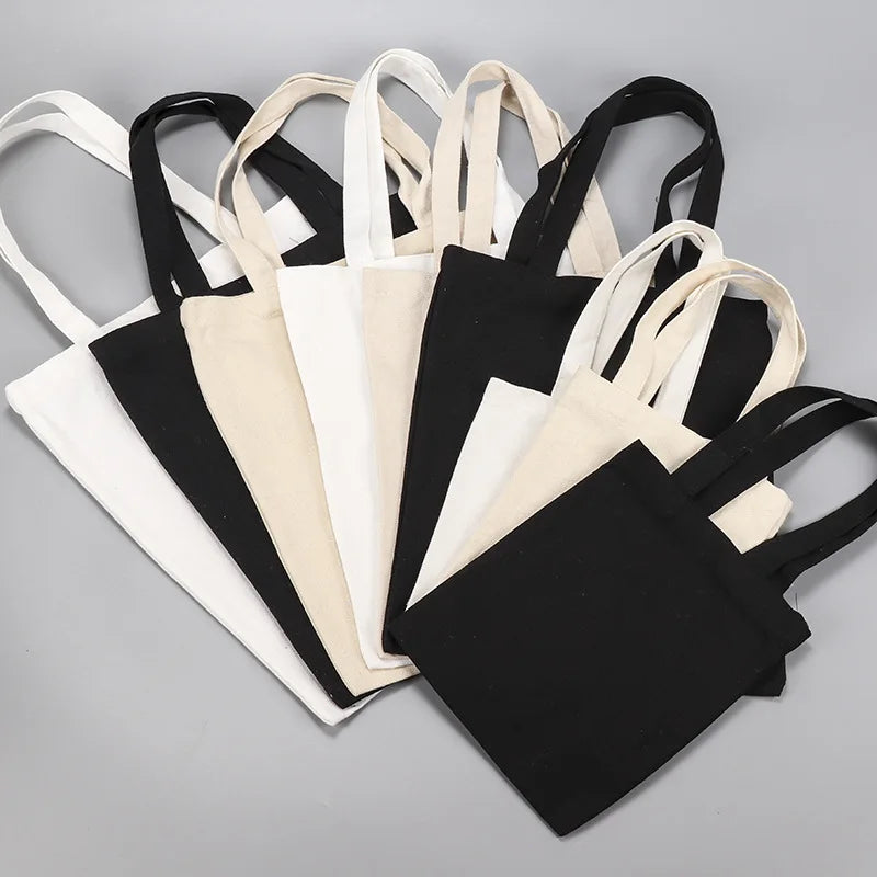 sac main toile réutilisable noir blanc beige classique uni opacité poignées respectueux environnement multifonction