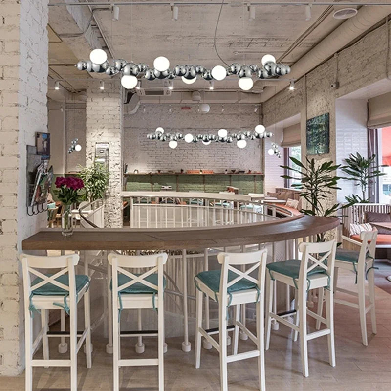 suspension lumineuse moderne doré blanc boules métalliques sphères translucides câble fixé nordique éclairage intérieur