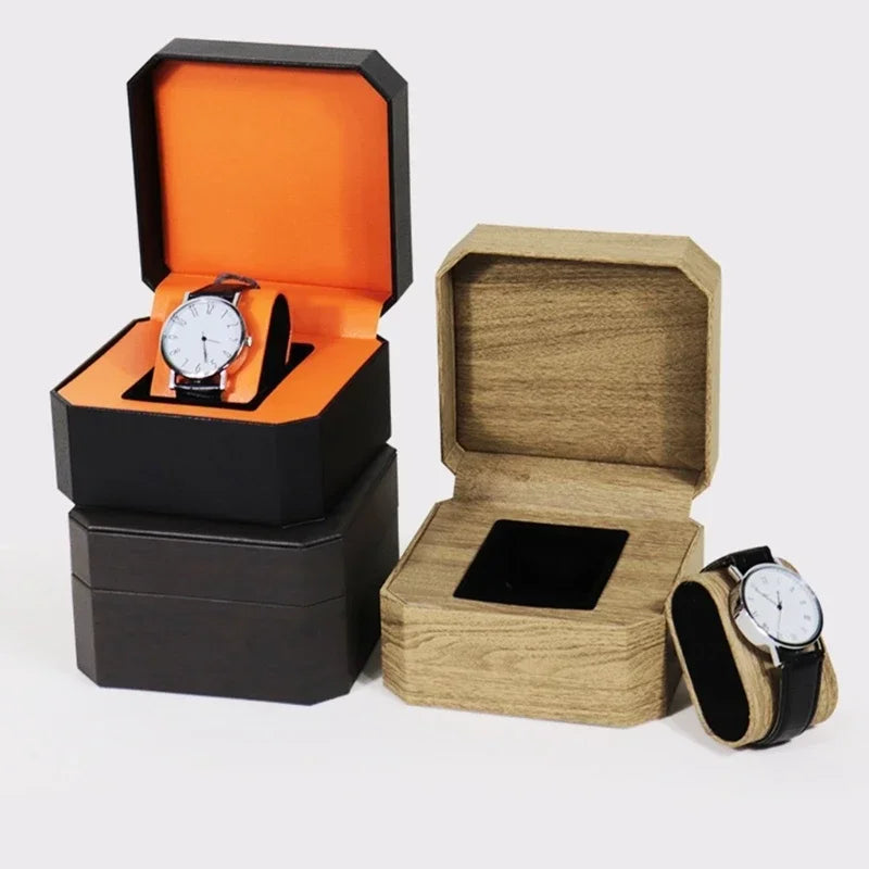 montre vintage cuir noir fond orange boite rangement elegante exposition