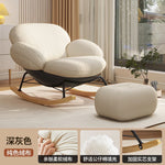 fauteuil bascule moderne beige noir orange roulettes coussin repos minimaliste salon