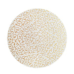 Motif décoratif circulaire avec des arabesques dorées sur fond blanc.