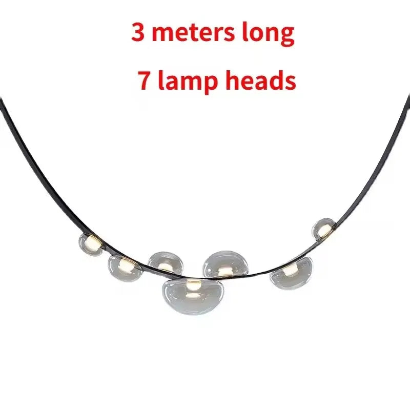 Suspension lumineuse contemporaine boules translucides structure métallique noir marron doré minimaliste