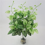 plantes artificielles violet vert marron feuilles ovales moderne décoration extérieure vase galets noirs blancs