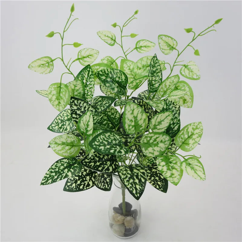 plantes artificielles violet vert marron feuilles ovales moderne décoration extérieure vase galets noirs blancs