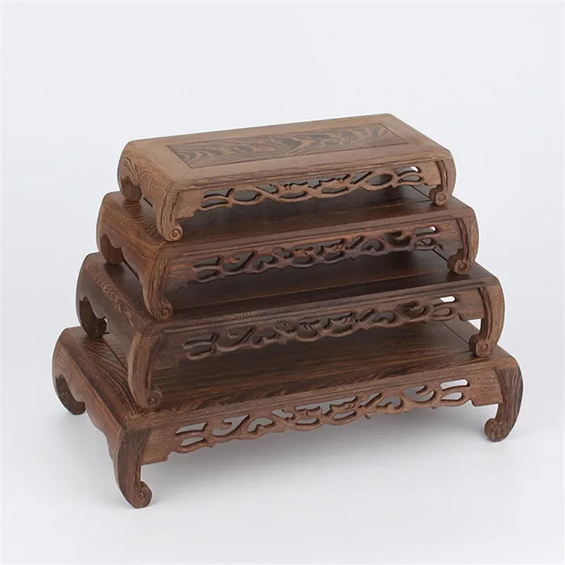 support décoratif bois artisanal marron foncé motifs sculptés table petite vase fleurs théière étagère