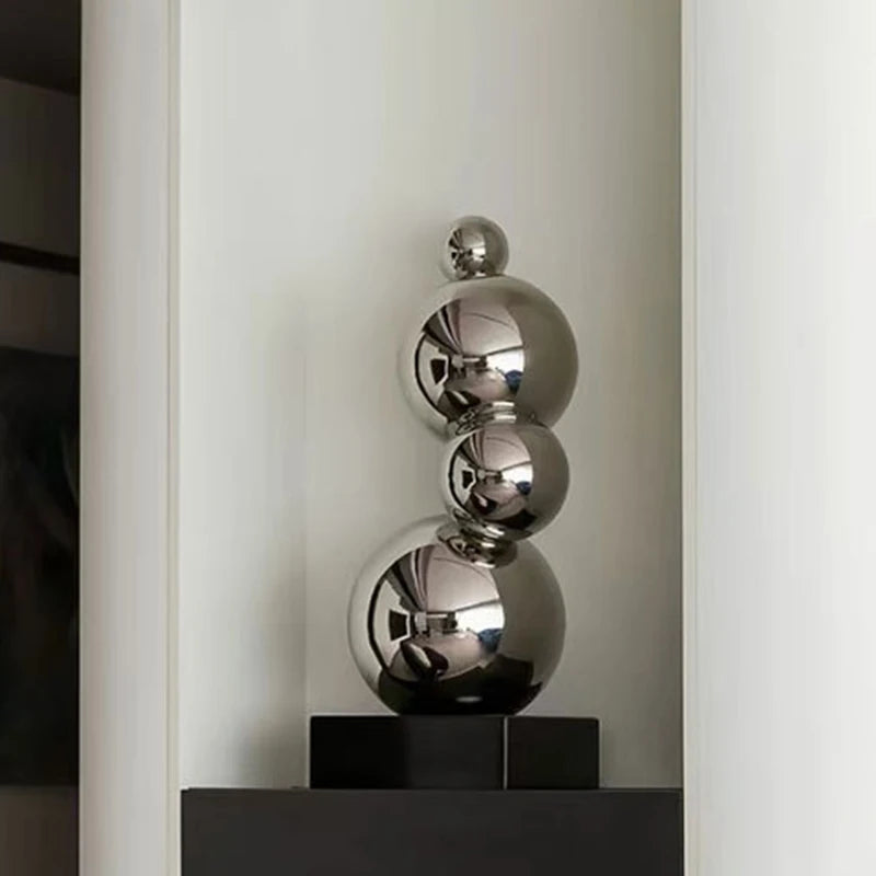 Sculpture décorative moderne or argent sphères polies métal base noire minimaliste
