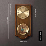 horloge murale bois grainé classique or noir décor asiatique personnages animaux