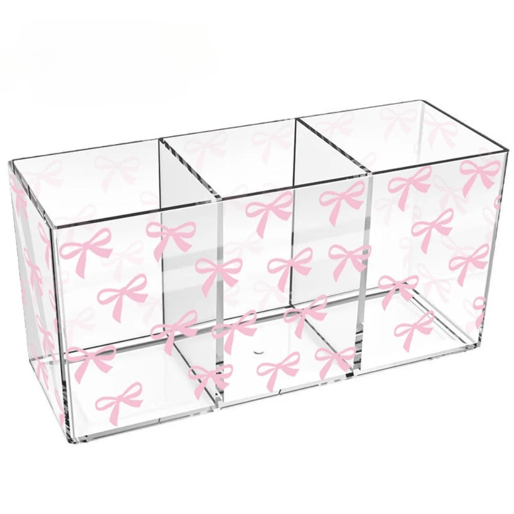 boîte rangement transparente rubans roses pinceaux maquillage bouteilles vernis moderne élégante pratique organisatrice