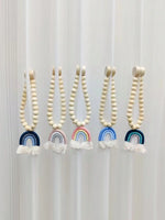 rideau boho chic arc ciel blanc pompons fenêtre maison hospitalité