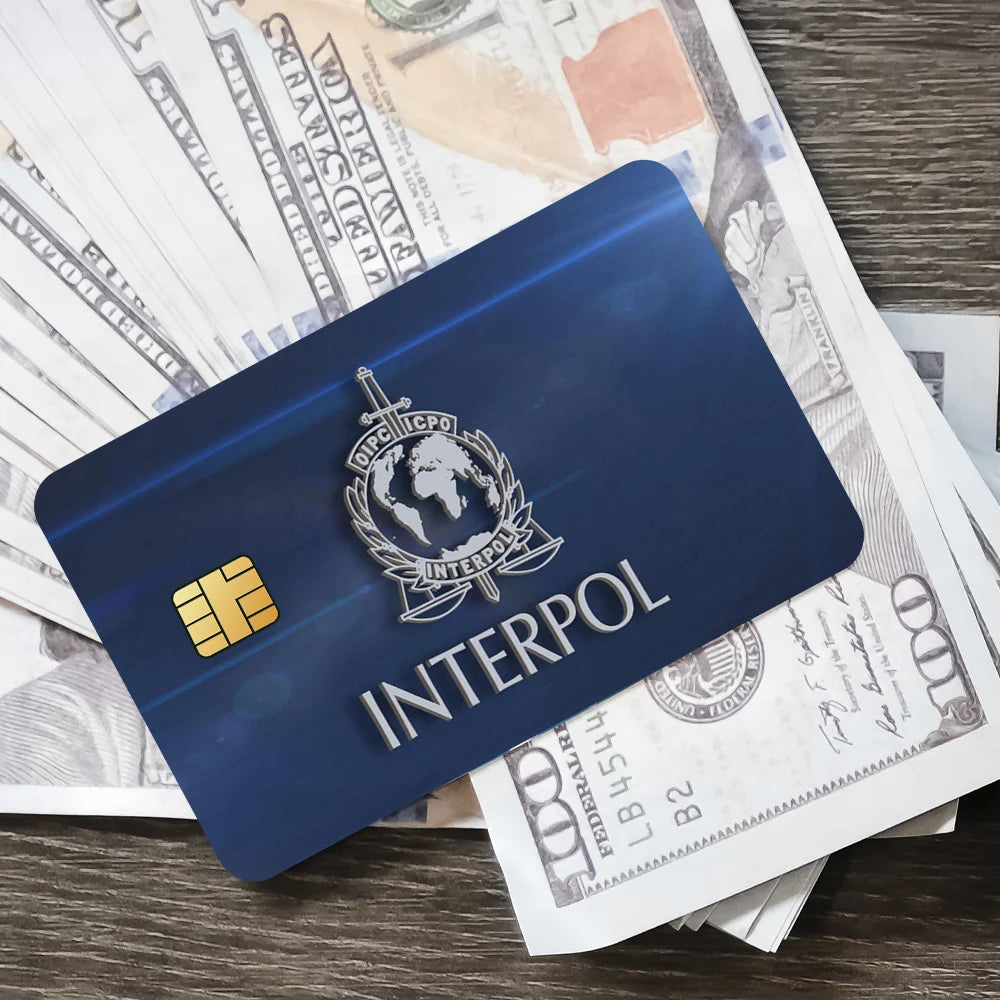 stylo bille bleu interpol logo globe épée carte bancaire