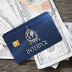 stylo bille bleu interpol logo globe épée carte bancaire