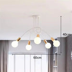 suspension lumineuse moderne minimaliste noir or blanc branches incurvées métal fixation ampoles led