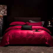 ensemble literie rouge profond tissu égyptien luxueux sombre élégant taies oreillers coutures apparentes