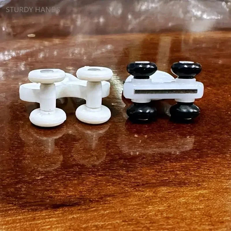 clips fixation rideaux blanc rondelettes noires robustes silencieux facilité déplacement fenêtre decoration quincaillerie fonctionnelle