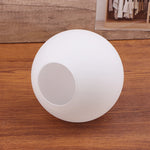 lampe table moderne minimaliste blanc base bois abat jour sphérique mat intérieur