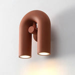 lampes murales modernes bleu turquoise noir blanc cassé rouille sculpturales éclairage quotidien minimaliste fixées