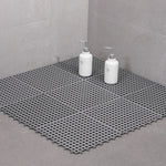 tapis salle bain blanc bleu turquoise vert gris jaune rose moderne minimaliste petits trous