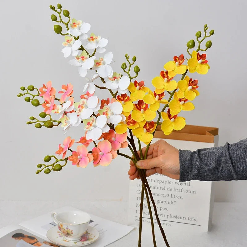 décoration intérieure bouquet orchidée papillon soie blanc rose orange jaune moderne minimaliste