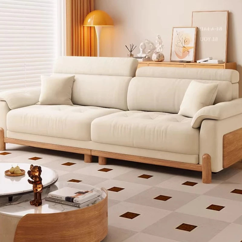 canapé places minimaliste moderne beige clair coussins ajustables table basse bois textures douces surpiqures