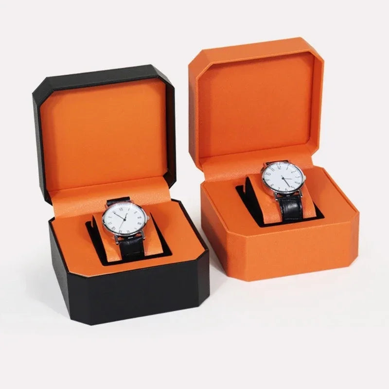 montre vintage cuir noir fond orange boite rangement elegante exposition