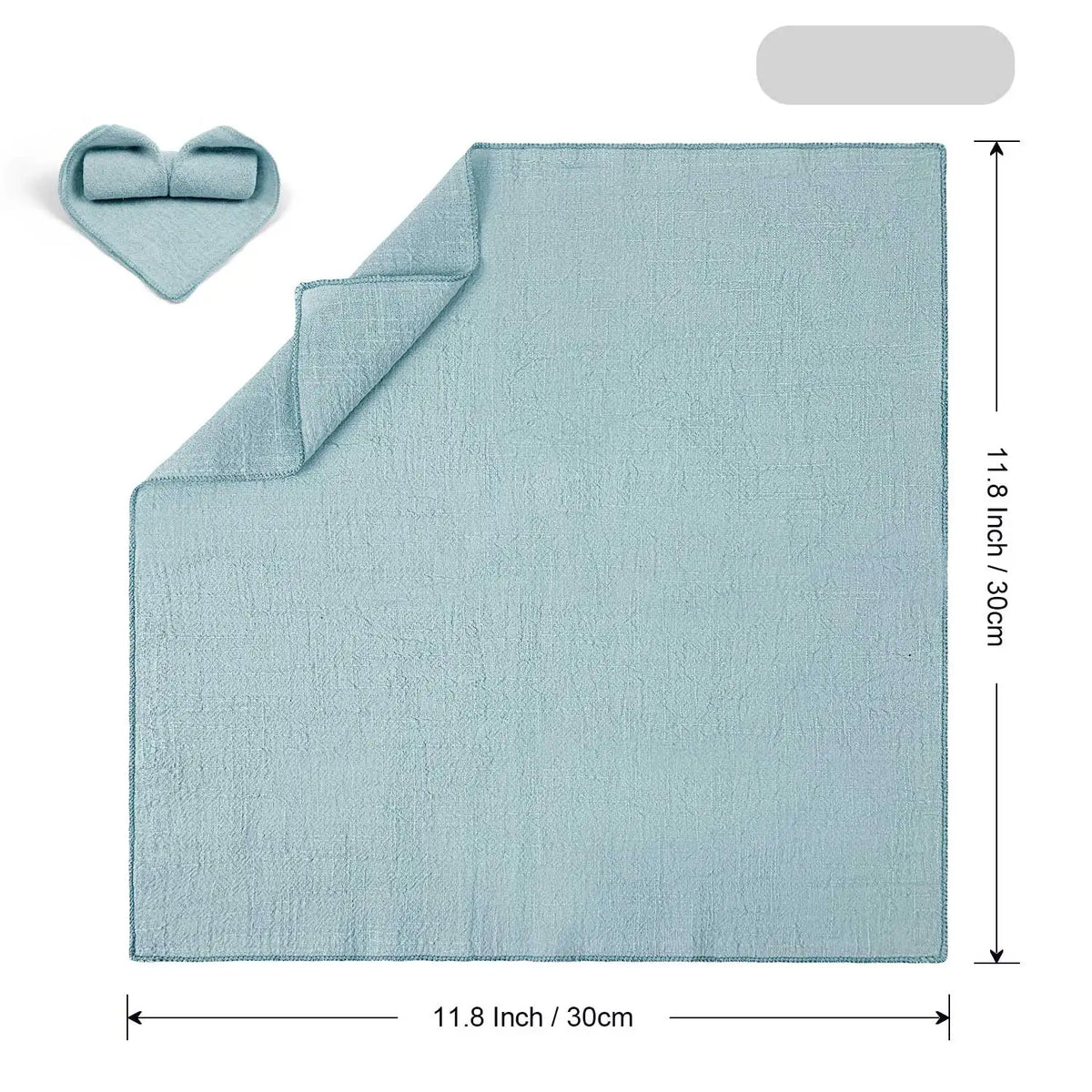 Une serviette de bain douce et absorbante de couleur vert menthe avec une forme de cœur sur le côté.