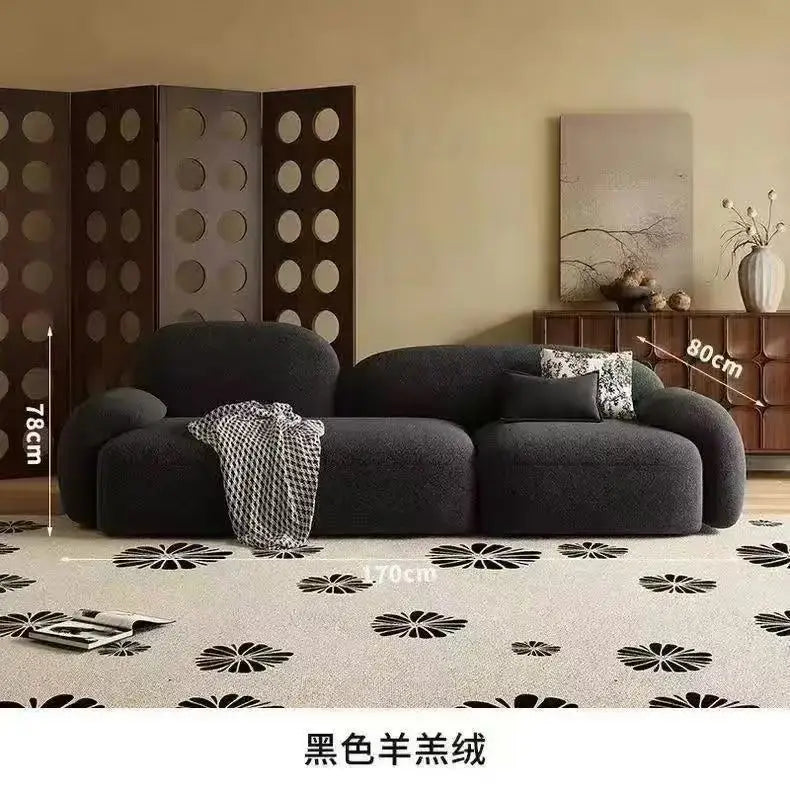 canapé moderne noir blanc fleurs motifs abstraits coussins plateau bois minimaliste italien scandinave