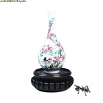 support vase bois relief dent scie couleur noire classique artisanal manuel
