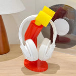 support casque audio porte livres moderne rouge jaune blanc minimaliste
