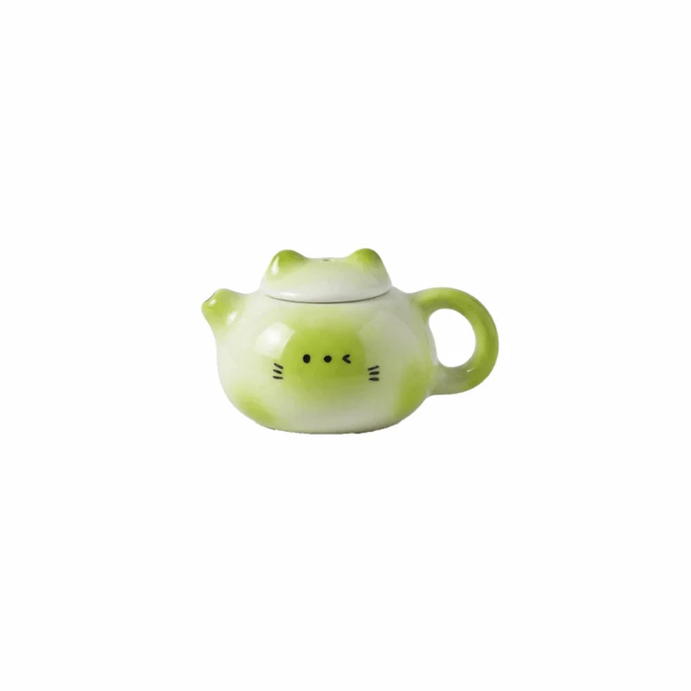 théière forme chat blanc rose vert jaune yeux noirs oreilles roses poils blancs décoration