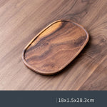 assiettes bois marron clair feuilles modernes métalliques thé tasses théière fruits noix