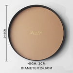 présentoir rond moderne plateau uni vert foncé orange noir maquillage soins parfums cosmétiques table
