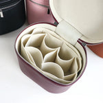 boîte rangement cosmétique simili cuir marron rose noir compartiments internes poignée amovible moderne pratique
