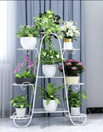 étagère plante métal structure florale courbe élégant pots blancs noirs fixations visuelles